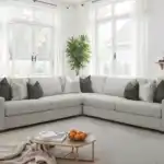 Romsey Light Gray Sectional Sofa with track arms and accent pillows in a bright transitional living room.