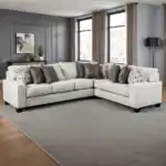 Millburn Sectional Sofa in white fabric with leatherette pillows in transitional living room.
