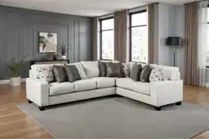 White Millburn Sectional Sofa with L-shaped design and accent pillows.