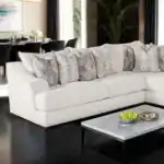 Moorpark Off-White Boucle Sectional Sofa in Tampa living room with accent pillows.