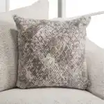 Moorpark Sectional Sofa taupe and gray textured accent pillow.