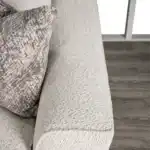 Moorpark Off-White Sectional Sofa arm and cushion close-up.