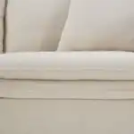 Close-up of Crayford Taupe Sectional Sofa cushion with feather blend filling and welt trim.