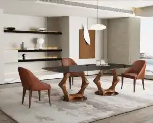 Modern rectangular glass top dining table with a unique geometric wooden base and brown leather chairs in a Tampa dining room.