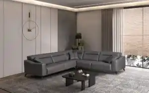  Modern grey leather sectional sofa with throw pillows, black coffee table, and minimalist decor in a Tampa home.