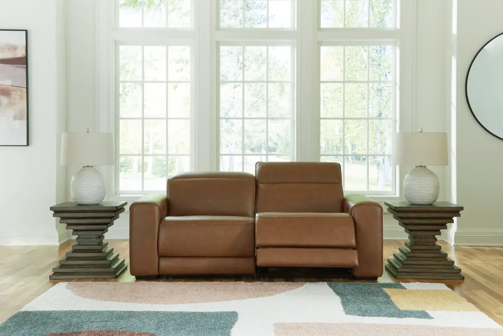 Magic Man 2-piece power reclining sectional loveseat in premium brown leather at Deluxe Home Decor & Furniture Tampa.