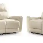 Dahlmoore power reclining sofa and loveseat combination in light almond leather, accessorized with pillows and throw blanket for a cozy, modern living room furniture look.