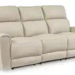 Dahlmoore power sofa fully closed, showing the contemporary silhouette and the soft almond-tone top grain leather. High-end modern reclining furniture.