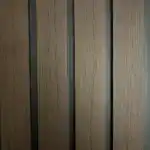 PVC walnut black fluted wall panel with modern decorative design for interior and commercial spaces.