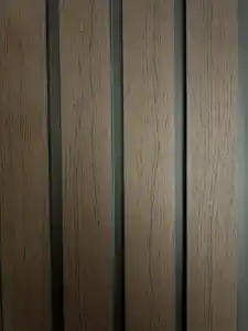 PVC walnut black fluted wall panel with modern decorative design for interior and commercial spaces.