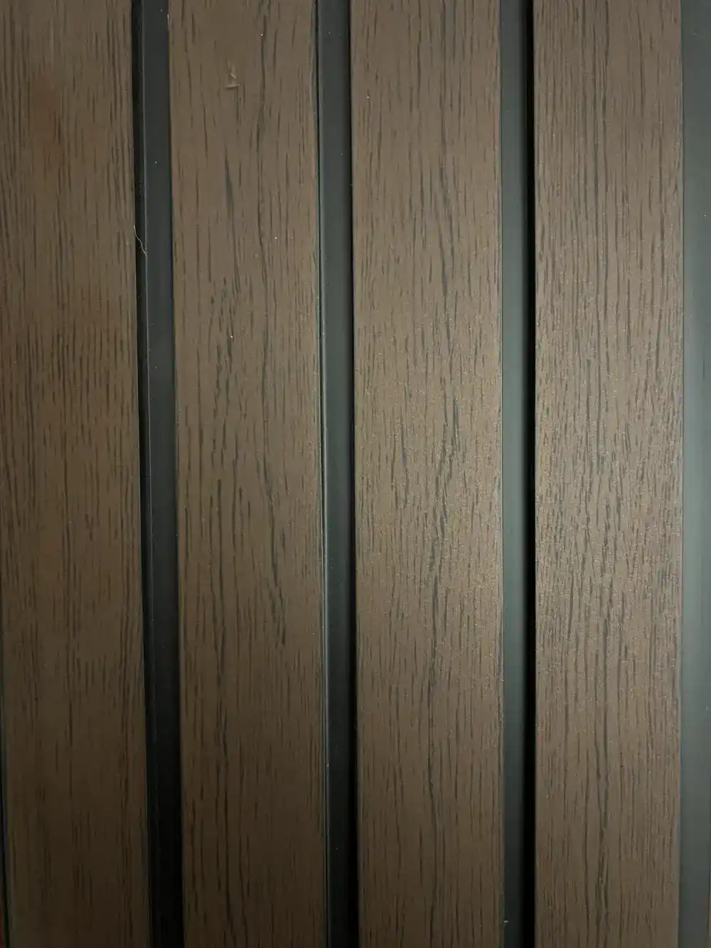 PVC walnut black fluted wall panel with modern decorative design for interior and commercial spaces.