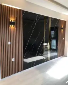 Modern black marble pattern PVC wall panel with wooden slats, ideal for wall mounted TV living room entertainment center