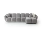 A modern gray boucle sectional sofa with a curved design in a stylish living room.
