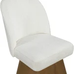 Angled view of cream swivel dining chair with textured upholstery