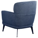 Back angled view of the blue upholstered chair.