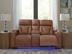 Clean-Slate Caramel Power Loveseat fully reclined in a living room setting, featuring the center console and blue LED lighting activated.