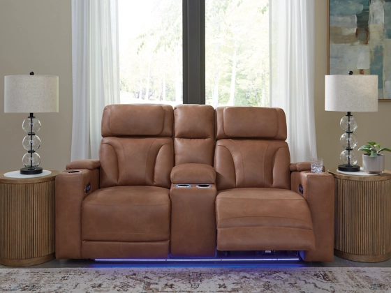 Clean-Slate Caramel Power Loveseat fully reclined in a living room setting, featuring the center console and blue LED lighting activated.