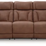 Full frontal view of the Clean-Slate Caramel Power Reclining Sofa, closed, showcasing the adjustable headrests and contoured seating.