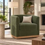 Geremy green swivel chair with forest green fabric and wood trim in Tampa FL house.