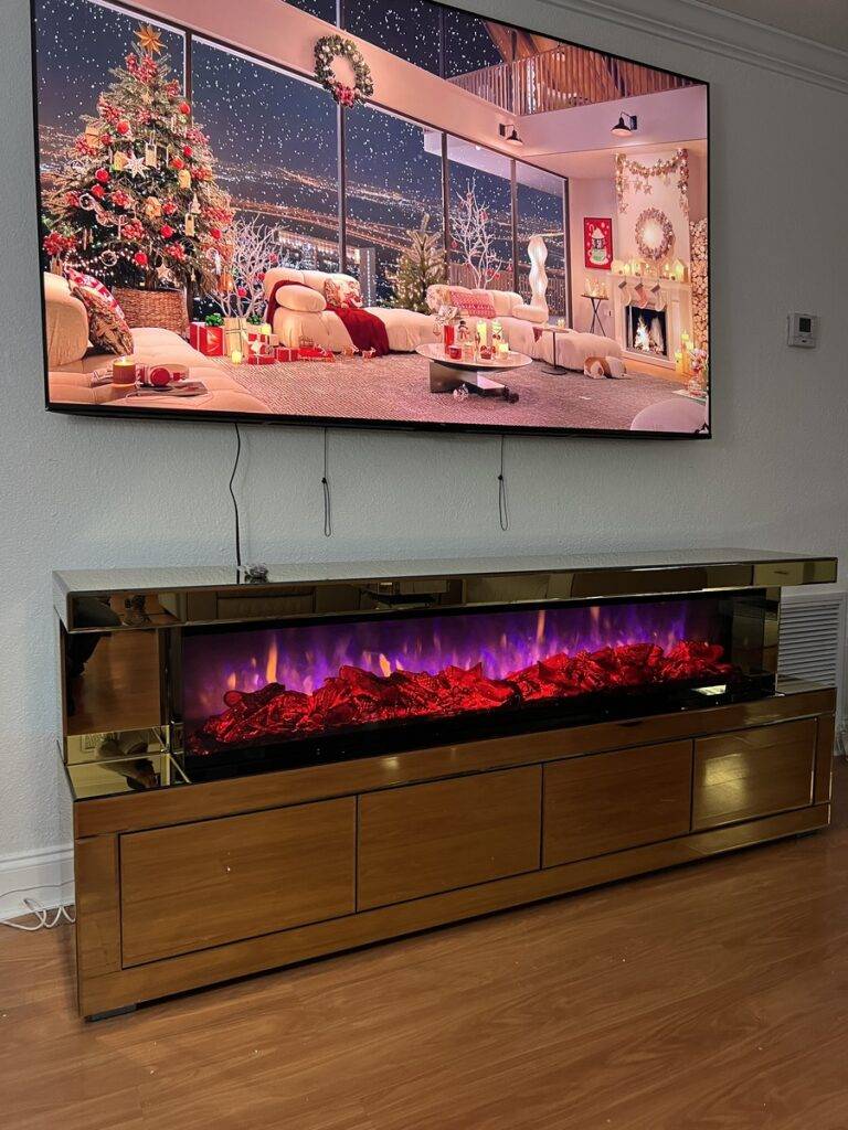 Gold mirrored fireplace TV stand with four storage compartments and electric fireplace
