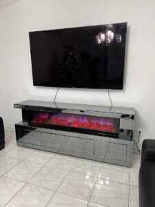 Gray mirrored electric fireplace TV stand with four storage compartments