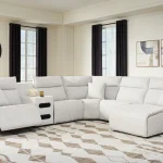 Modmax II light gray reclining sectional sofa with power headrests and console in a modern living room layout.