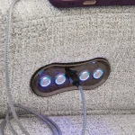 Close-up of the power reclining control panel with USB charging port on a light gray sectional sofa.