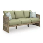 Angled view of Gumbet green outdoor sofa / couch showing curved silhouette, rope-wrapped arms, and wood-look eucalyptus frame