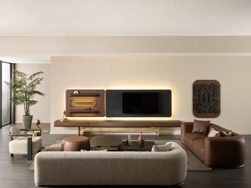Modern living room with large TV console, cream sofa and brown accent seating