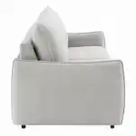Side profile of the Jinn Sleeper Sofa, detailing the curved, modern arm design, fabric texture, and 39" deep dimensions.