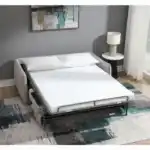 Jinn Sleeper Sofa fully open in bed position, featuring the full-size memory foam mattress set up in a cozy, modern guest room environment.