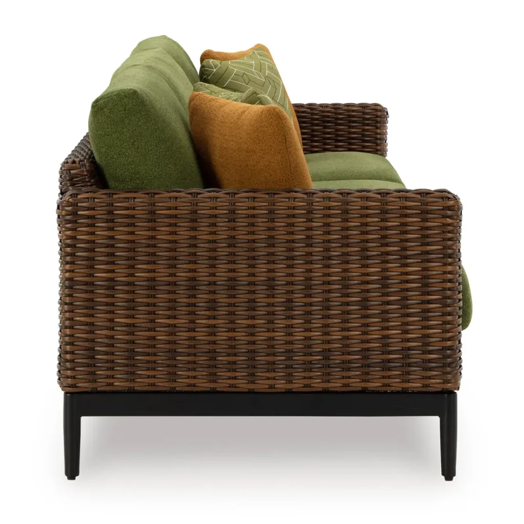 Side view of Kemer green outdoor sofa with woven wicker arm