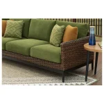 Green Nuvella cushions and brown wicker detail on Kemer patio sofa