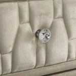 Close-up of ivory velvet fabric and faceted crystal knob on Lorient furniture.