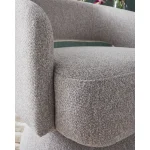 Luna pebble accent chair with bouclé upholstery and padded seat