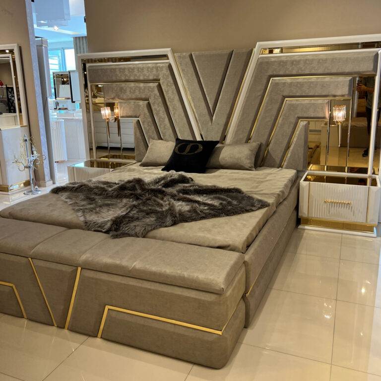V Bedroom Set featuring a luxurious bed with a gold-accented headboard, matching bench, and nightstand.