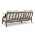 Angled back view of Milas beige aluminum outdoor sofa showing vertical wood-look aluminum slat design and curved armrest