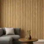 Oak PVC fluted wall panel with warm beige background and reddish-brown wood veins, installed in modern living room.