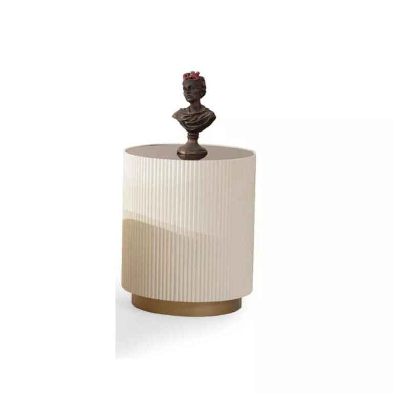 Modern cream and gold end table with sleek design, displayed at a furniture store in Tampa.