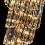 Premium K9 crystal rods and warm lights on a gold staircase chandelier