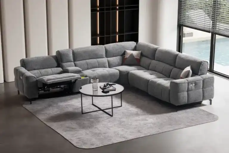 Modern gray reclining sectional sofa in a spacious Tampa living room