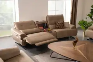 Modern taupe power reclining sectional sofa with a chaise lounge in a Tampa living room
