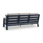Back view of Sile navy blue outdoor sofa showing horizontal MEGA-TUFF HDPE slat panels, aluminum frame construction, and driftwood-look finish