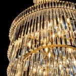 Close-up of tiered K9 crystals on the gold Spiral chandelier