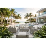Yalı gray outdoor sofa furniture set arranged on poolside patio with ocean view, palm trees, swivel chairs, coffee table, and ottoman